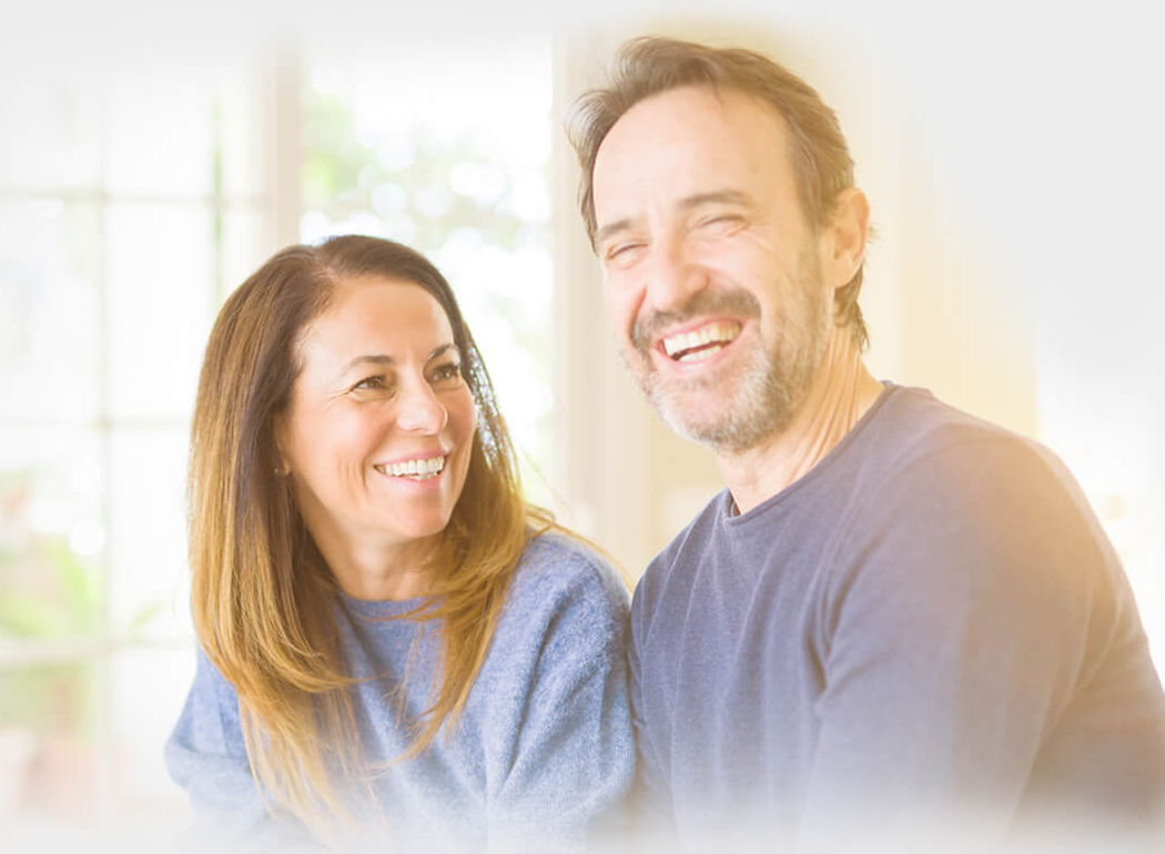 Middle-aged couple smiling after receiving HST rebate